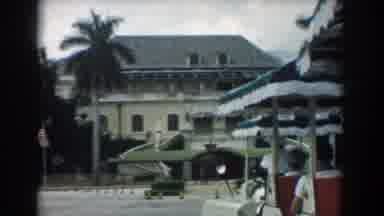 South Carolina (1958): View Of Tan House And Palm Trees On A Clear Day