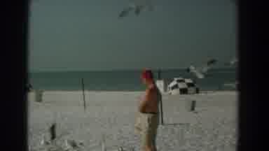 Yorktown Virginia (1958): Shirtless Guy Wearing Shorts And Red Hat Feeds Seagulls