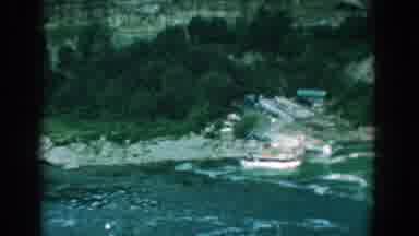Yorktown Virginia (1958): A White Bird Flies Across A Beach With A Rock Cliff