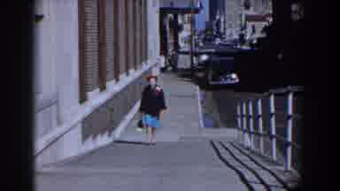 Yorktown Virginia (1958): Woman Wearing Formal Outfit Walks Up Steep Sidewalk