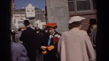 Yorktown Virginia (1958): Woman In Crowded Area Putting On Gloves And Walking
