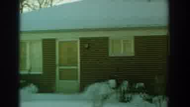 Florida (1959): Couple Shoveling Snow In Front Of Their Brick House On Sunny Day