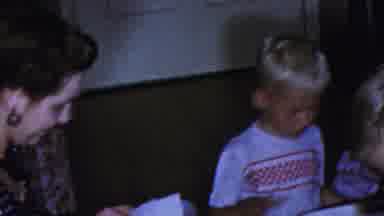 Paramus New Jersey (1959): Three Young Children Unwrapping Gifts While Older