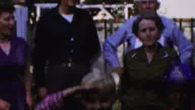 Paramus New Jersey (1959): Boy Wearing Red Plaid Shirt Salutes While Walking