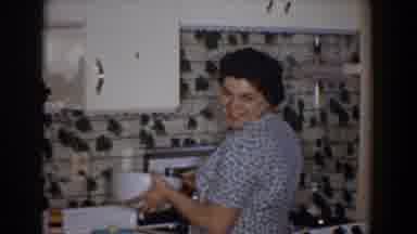 Bel Air Maryland (1960): A Woman In A Blue Dress Cooking In The Kitchen Turns