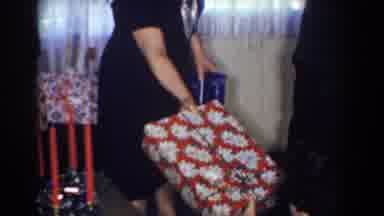 Bel Air Maryland (1960): A Woman Giving A Small Child A Present Whilst The A Boy