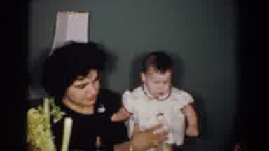 Bel Air Maryland (1960): Woman Wearing Black Dress Holds Baby Wearing Red And