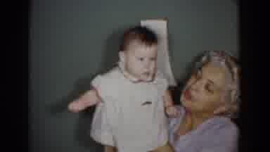 Bel Air Maryland (1960): Beautiful Baby Wearing White Dress Playing Bouncing Game