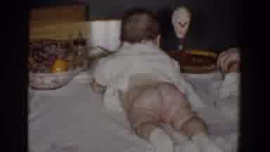 Bel Air Maryland (1960): Boy Wearing Grey Shirt Stacks Gift Boxes Next To