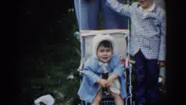 Bel Air Maryland (1960): A Toddler Girl Sitting In A Baby Carriage Next To Her Is
