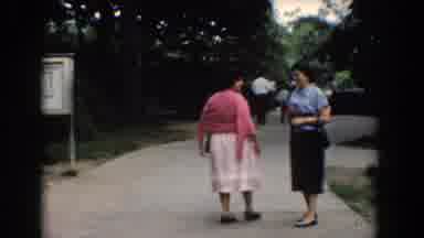 Bel Air Maryland (1960): Standing Ladies And Man With Child Walk And Talk