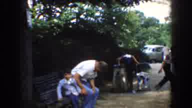 Bel Air Maryland (1960): Man Wearing Black Pants Pushes Baby Wearing Blue Coat In