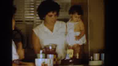 Bel Air Maryland (1960): Woman Wearing White Shirt Holds Baby Wearing White Romper