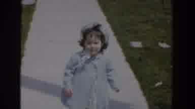 Bel Air Maryland (1960): Toddler Walking On A Sidewalk Wearing A Bonnet And A Coat