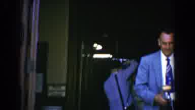 Bel Air Maryland (1960): Suited Photographer Talks To Bride And Man At Wedding