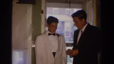 Bel Air Maryland (1960): Man In Dark Suit Hands Younger Man In White Tuxedo Small