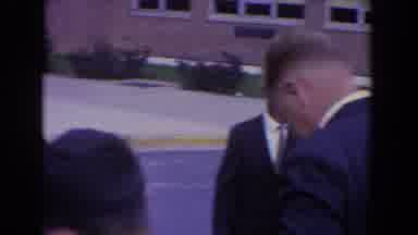 Bel Air Maryland (1960): Group Of Well Dressed People Waiting Outside A Building