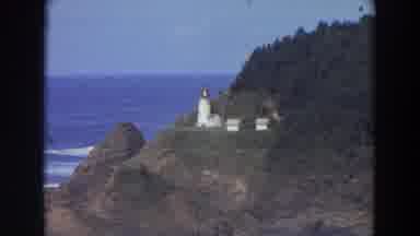 California (1964): View Of White Lighthouse On Green Hill On A Clear Sunny Day