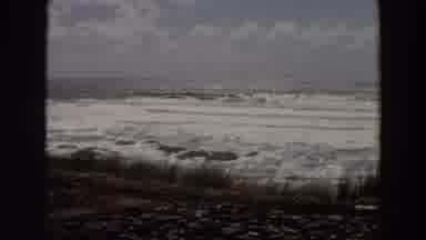 California (1964): View Of Ocean Surf And Green Grass On A Bright Sunny Day