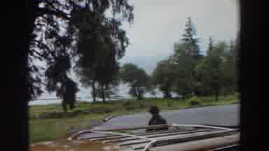 California (1964): A Motel And A Lake And The Parking Lot Looking Out Towards The