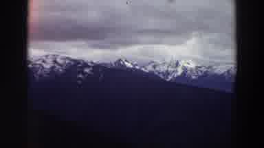 Washington (1964): View Of Snow Covered Mountains And Grey Clouds On A Cloudy Day