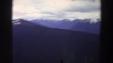 Washington (1964): View Of Snow Covered Mountains And Puffy White Clouds On A