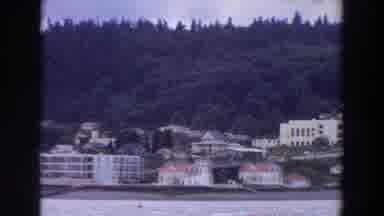 Washington (1964): A Large Lake With Many Buildings And Mountain On Its Shore