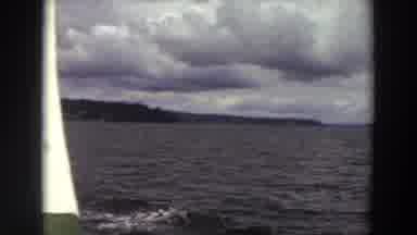 Washington (1964): View Of Mountains And Ocean Water On A Cloudy Day