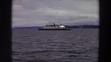 Washington (1964): Ship On Water With Somewhat Distant Shoreline Then Sign Saying