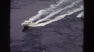 Washington (1964): Two Motor Boats Sail Together Through Calm Waters Leaving Small