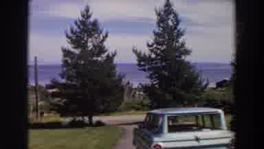 Washington (1964): Panning Camera View Of Car Parked In Suburban Neighborhood