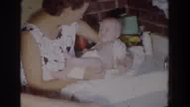 Fallston Maryland (1965): A Mother Holds Her Baby Above A Bathtub And Comforts The