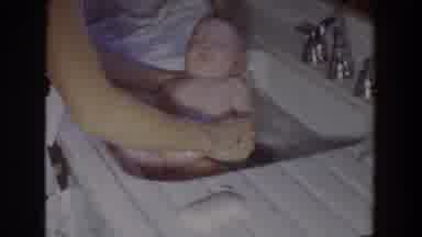 Fallston Maryland (1965): Parent Giving Baby Girl A Bath In A Sink