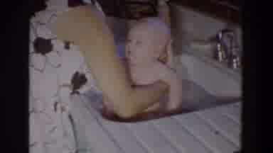 Fallston Maryland (1965): Woman With Head Not Visible Bathing Baby In Kitchen Sink