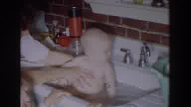 Fallston Maryland (1965): Mom Giving A Baby A Bath In Kitchen Sink With Daughter