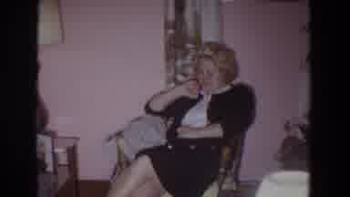 Fallston Maryland (1965): Woman Wearing Black Suit Shields Face While Man Wearing