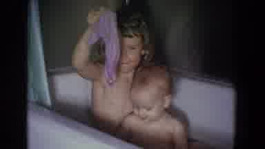 Fallston Maryland (1965): Girl Holds Up Purple Cloth While Sitting In White Tub