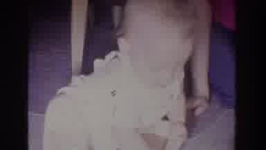 Fallston Maryland (1965): Young Child Tries To Put A Object In His Mouth But Is