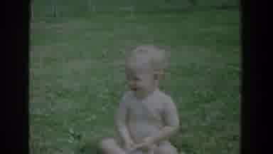 Fallston Maryland (1965): Blonde Haired Baby Sitting Outside On Grass Smiling And