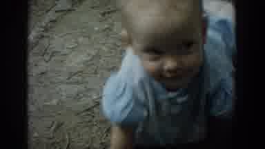 Fallston Maryland (1965): Baby Playing In The Mud While Father Watches On A