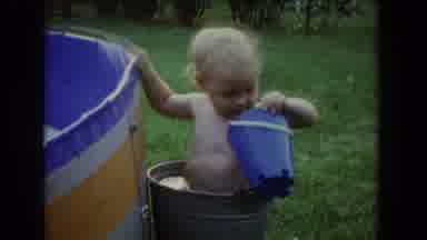Fallston Maryland (1965): Baby Boy Bathes And Plays In The Garden With A Bucket
