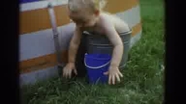 Fallston Maryland (1965): Cute Baby Is Having A Hard Time Getting Out Of A Tin