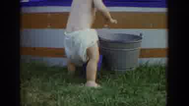 Fallston Maryland (1965): Summertime Young Child In White Diaper Playing With Blue