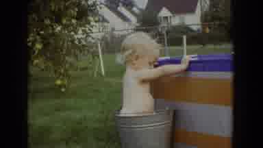 Fallston Maryland (1965): A Toddler Plays In A Bucket Next To A Lawn Pool