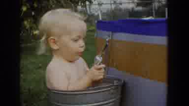 Fallston Maryland (1965): Baby In A Bucket Playing With Toy Gun While Mother Can't
