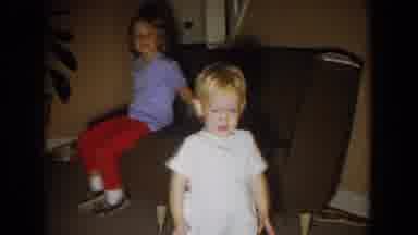 Fallston Maryland (1965): Girl Wearing Blue Shirt Laughs At Baby Wearing White