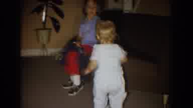 Fallston Maryland (1965): Toddler Wearing White Pants Picks Up Small White Object