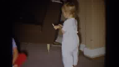 Fallston Maryland (1965): A Baby Walking Across The Living Room Floor With Food