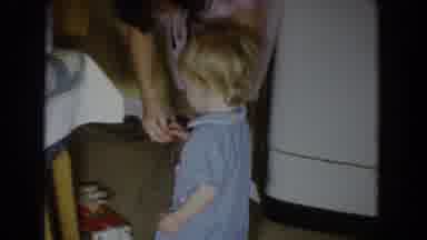 Fallston Maryland (1965): Toddler Wearing Blue Romper Walks Away From Woman