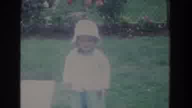 Fallston Maryland (1965): A Toddler Boy Outside Wearing A White Bucket Hat Walking